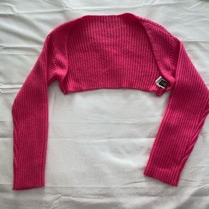 Pink halter top with pink shoulder shrug cardigan.